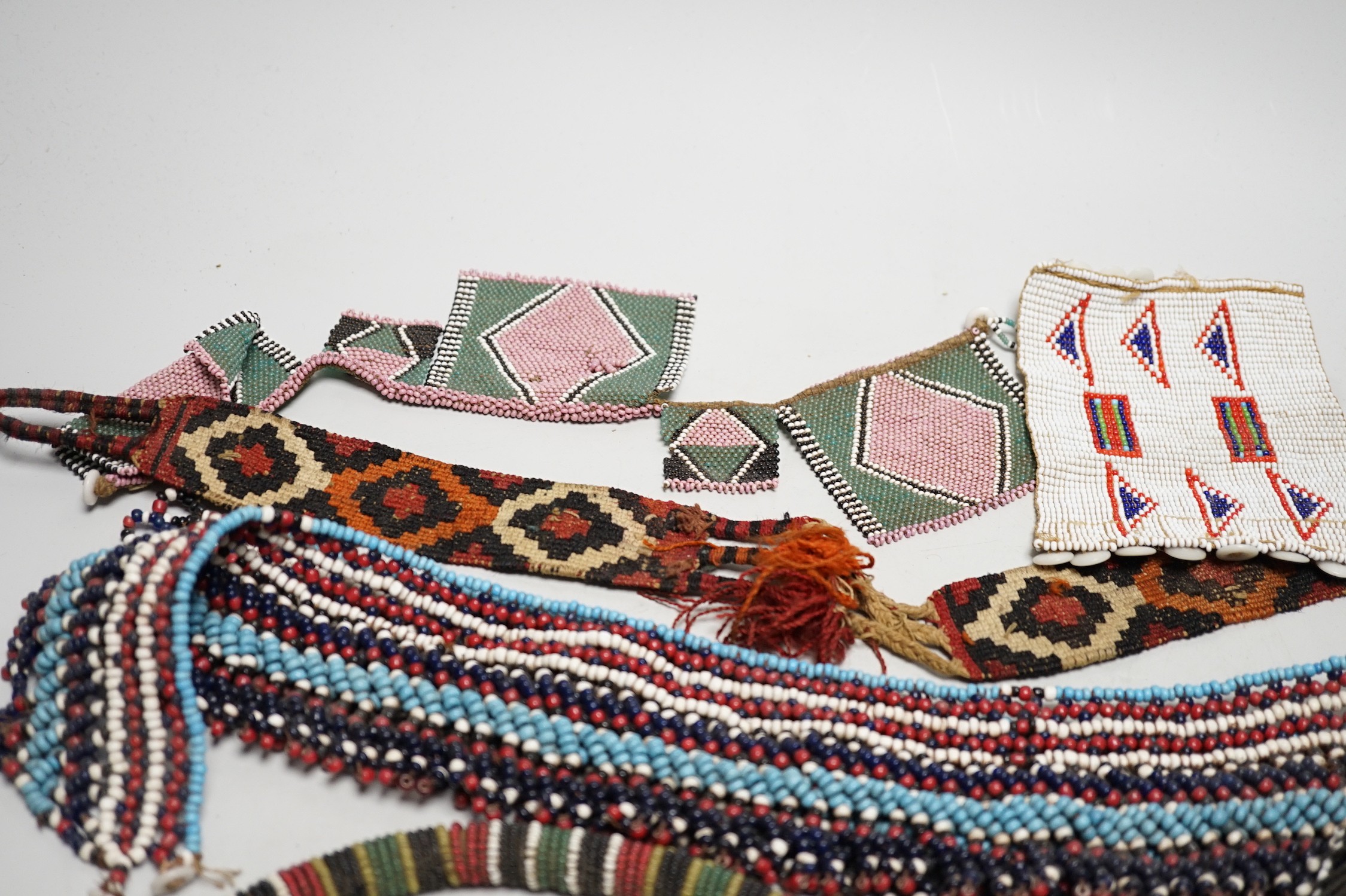 A selection of tribal geometric beadwork, to include a waistband believed to be Zulu